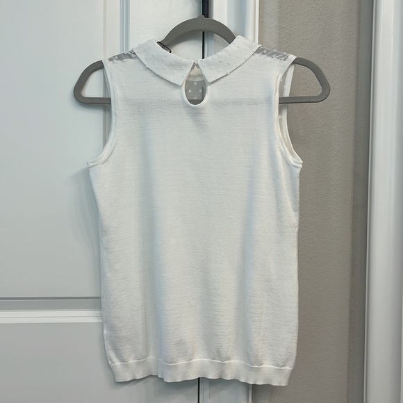 Lightweight sleeveless knit top with sheer accents around the collar. - Picture 4 of 5